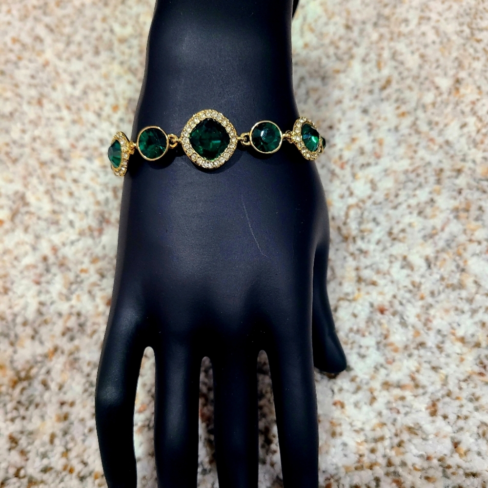 Gold bracelet with jade colored stones. Great gift for anyone!